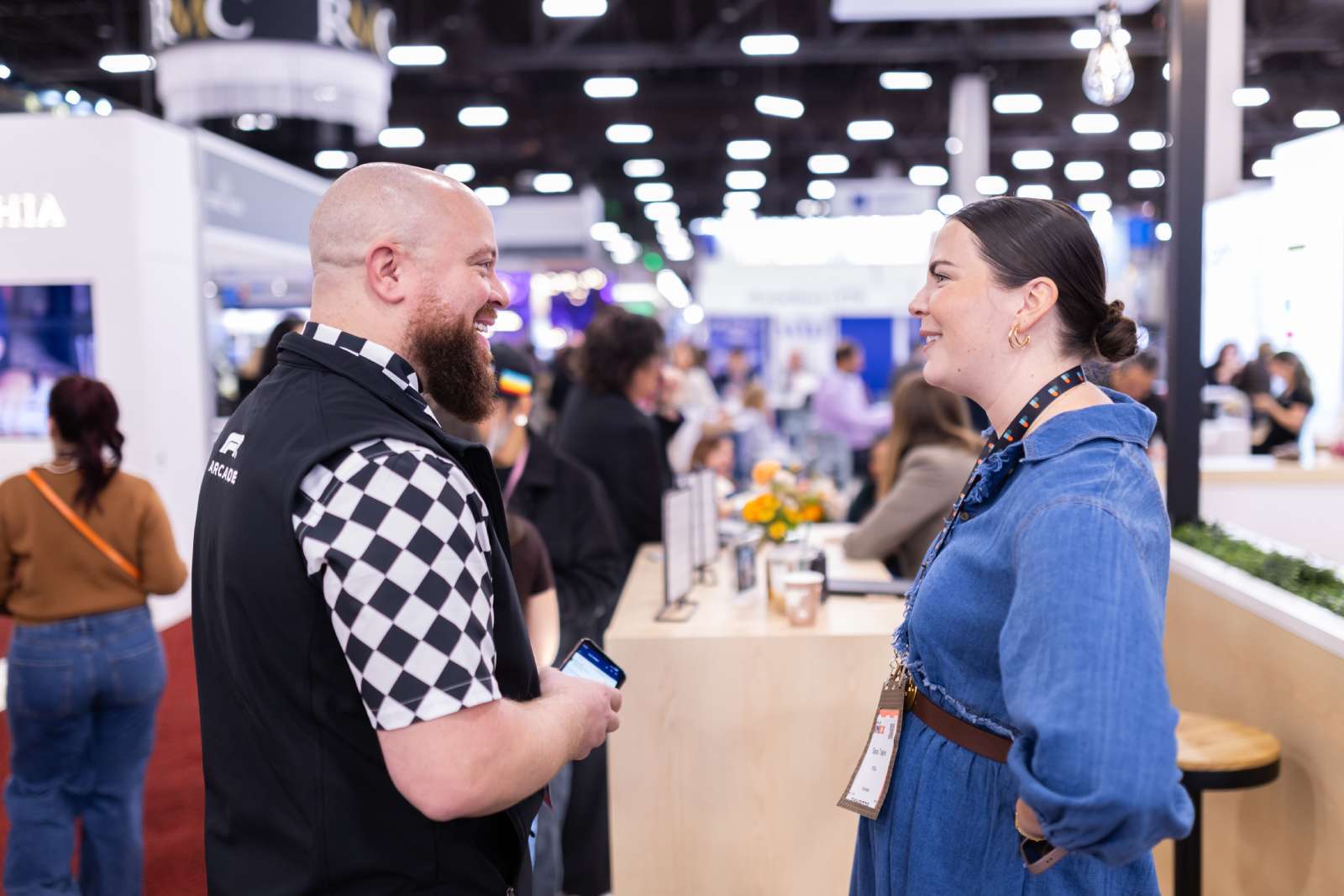 Man and woman talking at IMEX conference