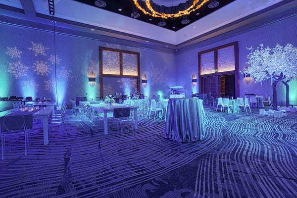 Wide view of a banquet hall with winter décor