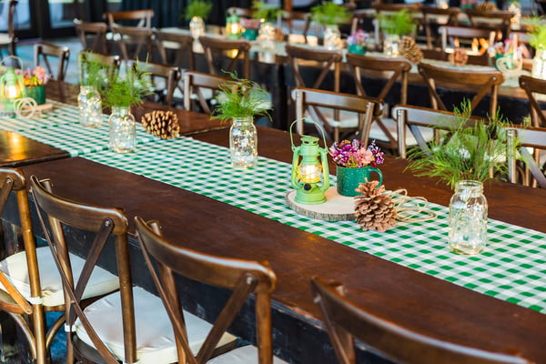 Banquet tables with camp-inspired décor. 