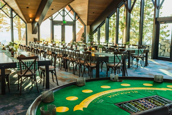 Lodge dining setup with panoramic windows. 