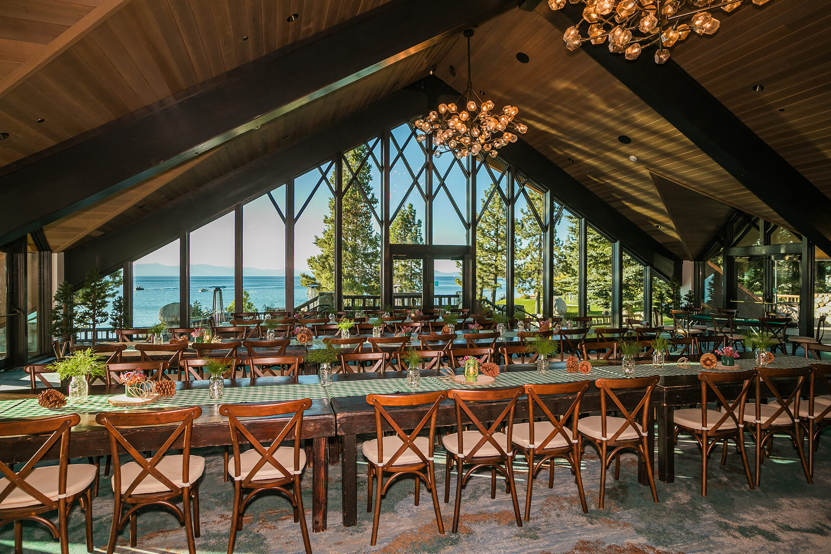 Rustic lodge dining room with lake views. 