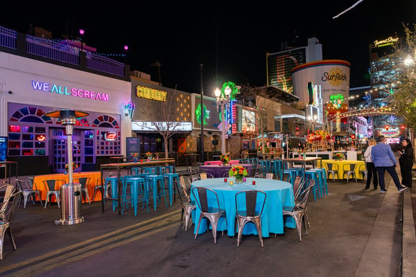 Outdoor dining setup on a closed city street. 