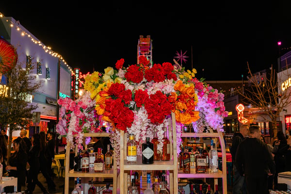 Floral installation in a nighttime event space. 