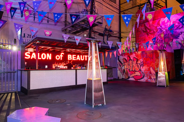 Neon-lit event space with lounge seating. 