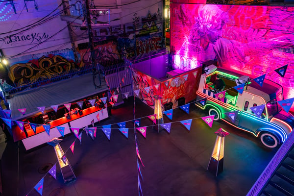 Overhead view of a colorful nightlife event. 