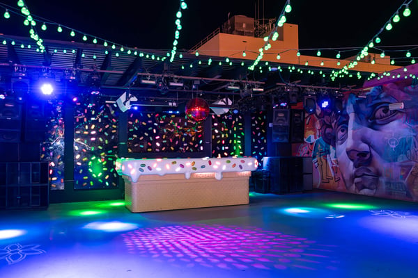 Illuminated outdoor lounge area at night. 