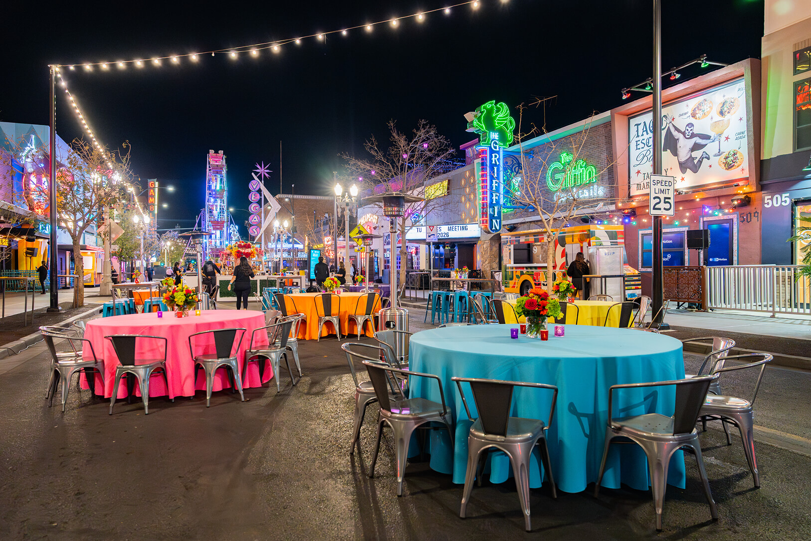 Street event seating with illuminated entertainment venues. 