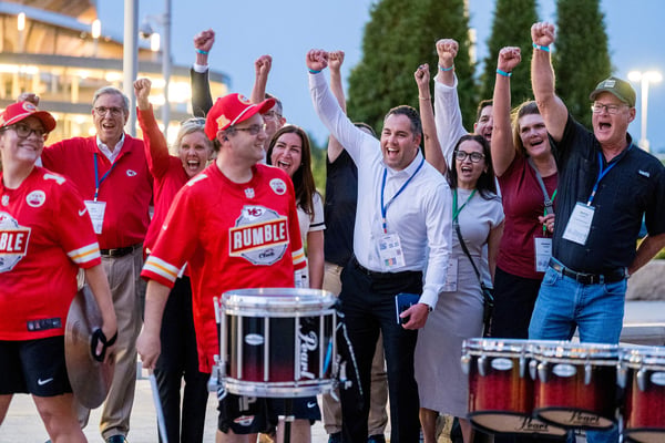 Guests cheering during a team-building eve