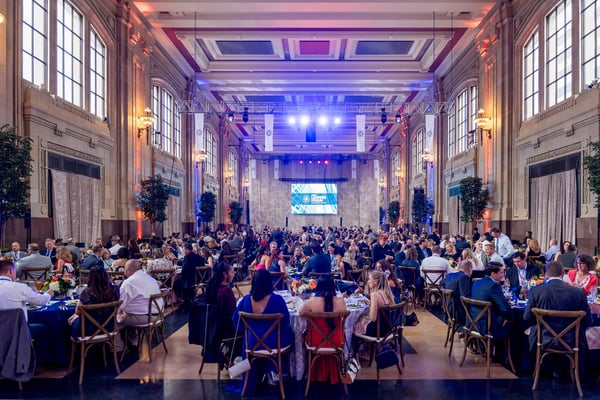 Awards banquet in a historic event hall. 