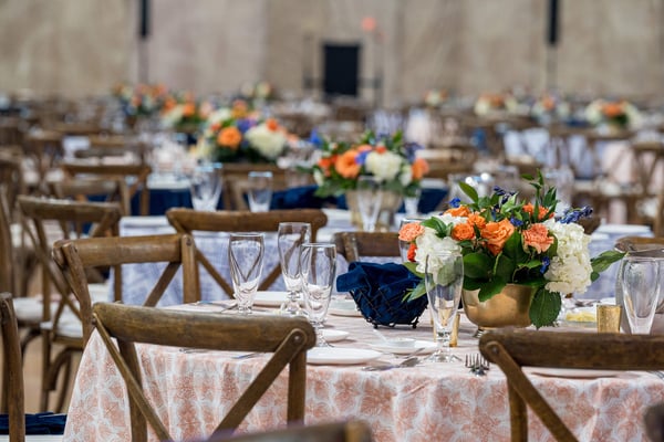 Elegant banquet tables with floral centerpieces. 