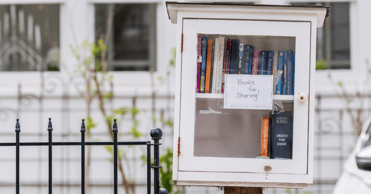 Neighborhood book-sharing box filled with books.