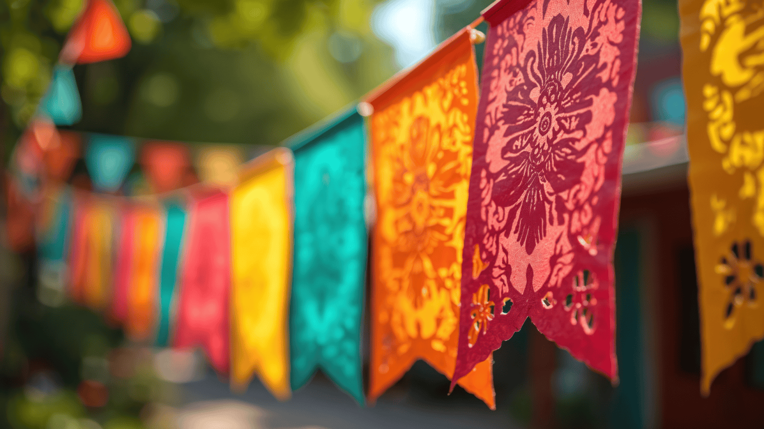 Colorful papel picado banners hanging outdoors.