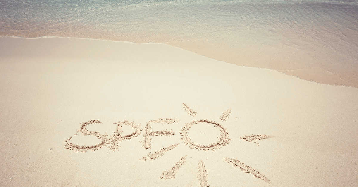 SPF written in sand beside the shoreline.