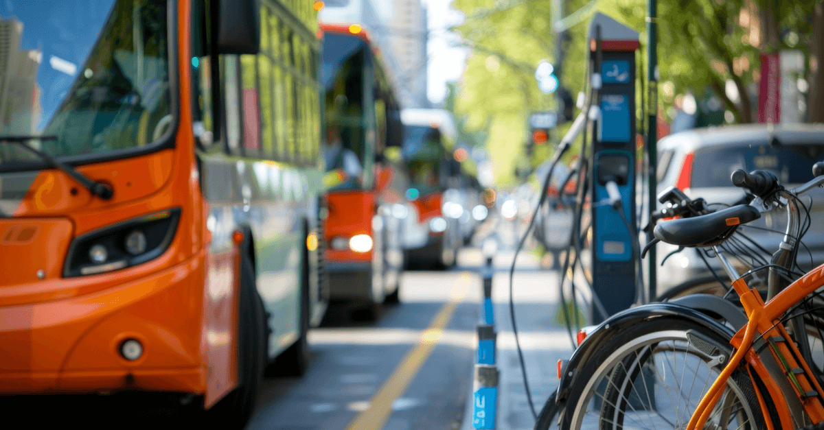 City street scene with a bus and bicycles, suggesting urban transportation options.