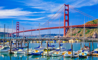 View of the Golden Gate Bridge and sailboats in San Francisco during the day